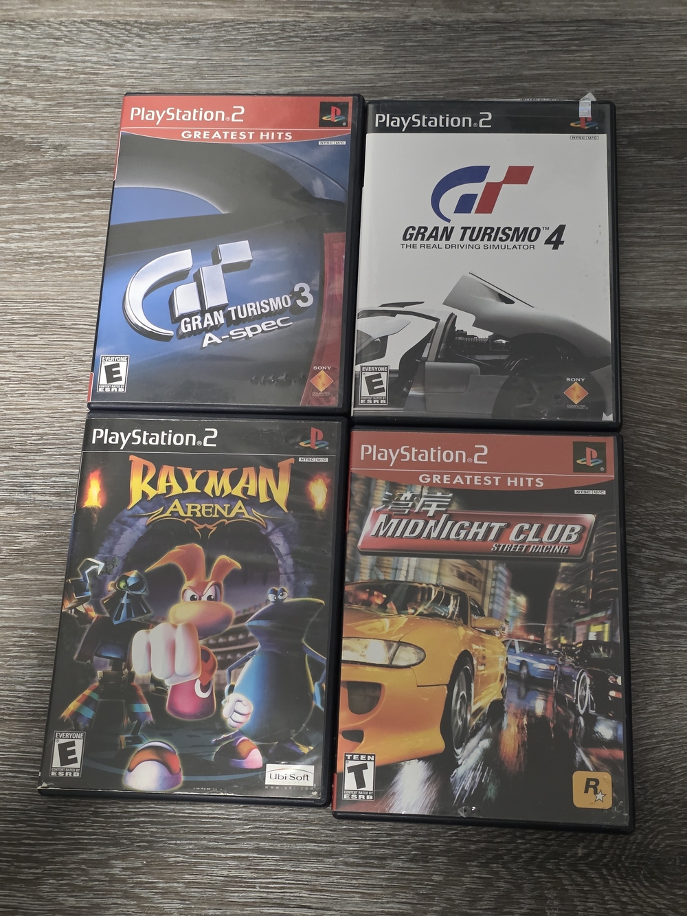 Sony PlayStation 2 Racing & Action Game Lot - Black/Red/White/Yellow